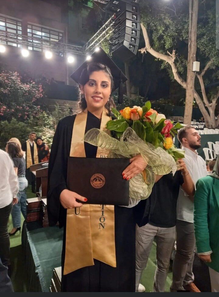 Graduate holding a diploma