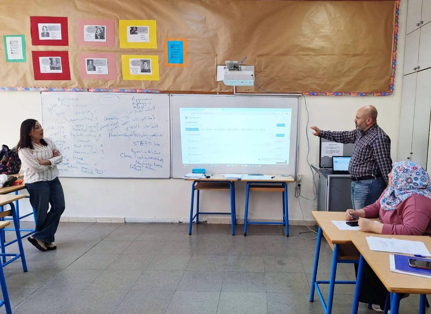 Students and teachers in a classroom workshop